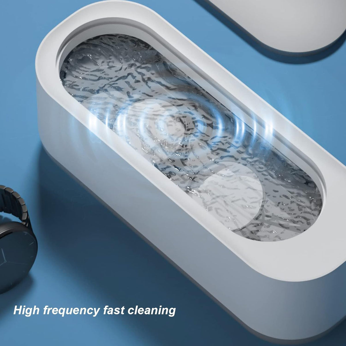 Jewellery cleaner tank with water and vibration ripples