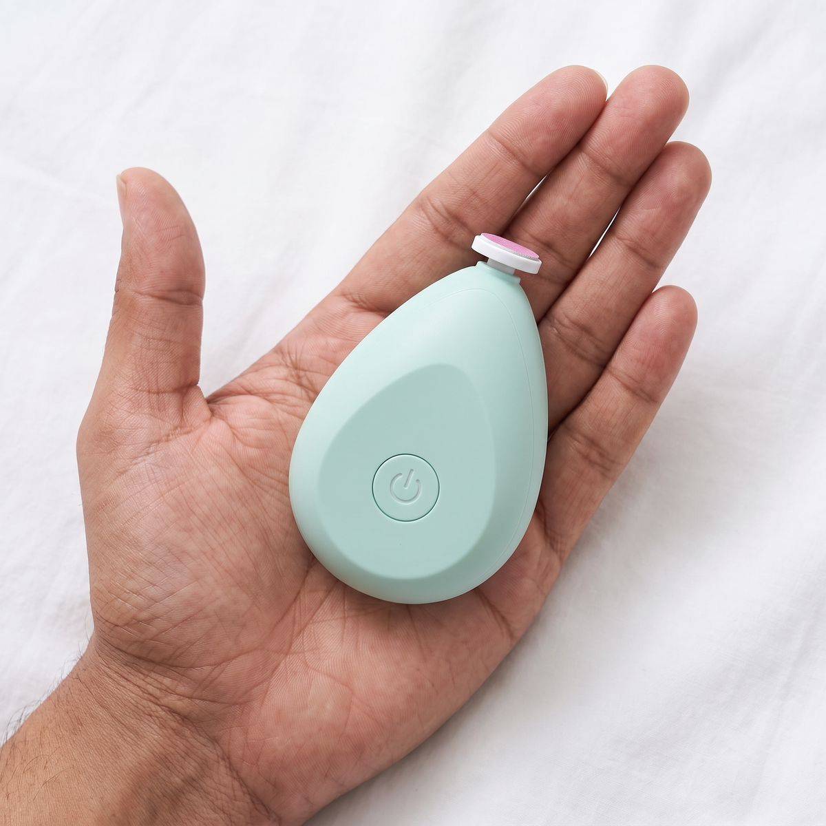 Baby nail trimmer size in an adult palm