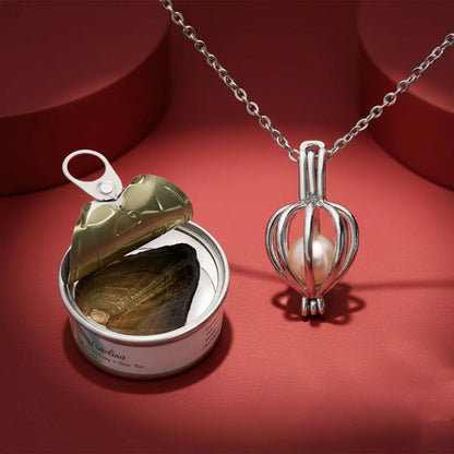 Pearl pendant necklace on a fine chain, shown with the pearl tin