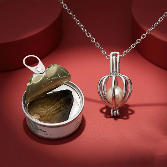 Pearl pendant necklace on a fine chain, shown with the pearl tin