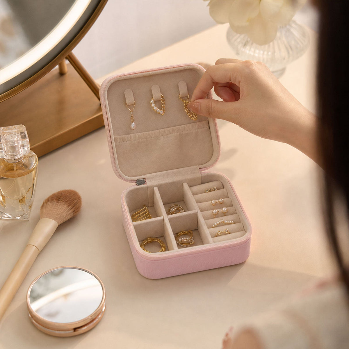 Hanging earrings on the lid hooks of the travel jewellery box