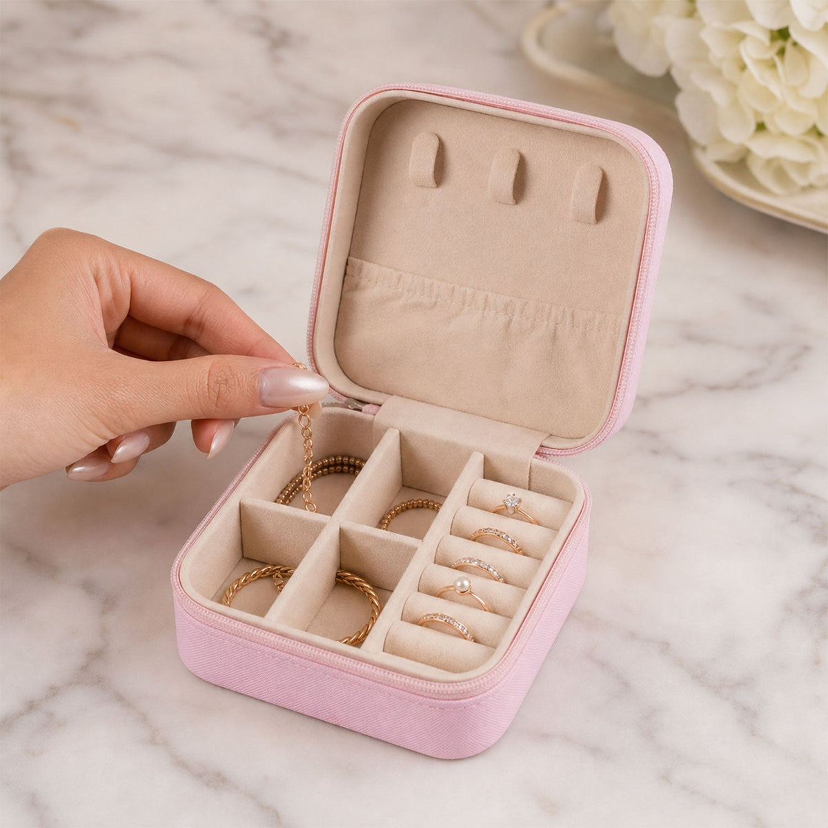 Travel jewellery box open with ring rows and compartments