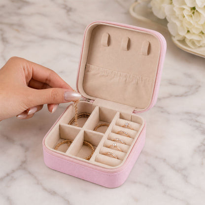 Travel jewellery box open with ring rows and compartments